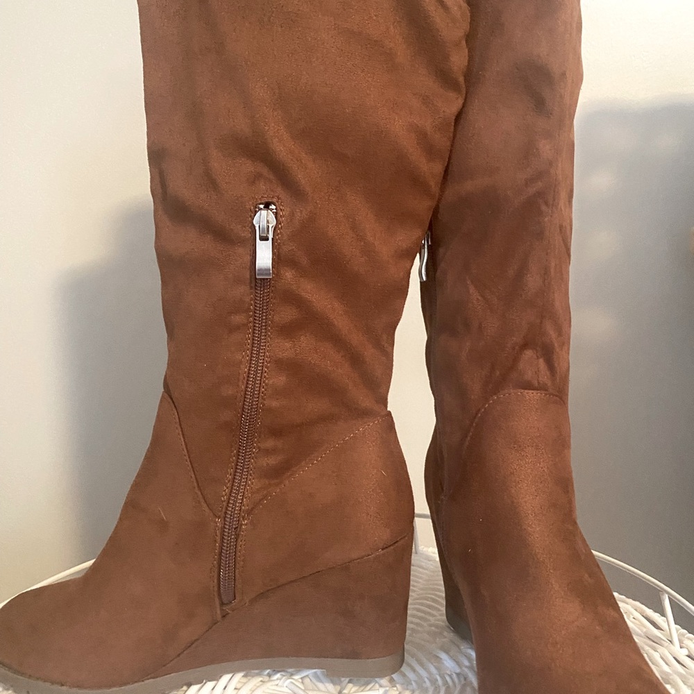 Like New! Never worn size 7 1/2 wedge boot, below knee with side zipper.
